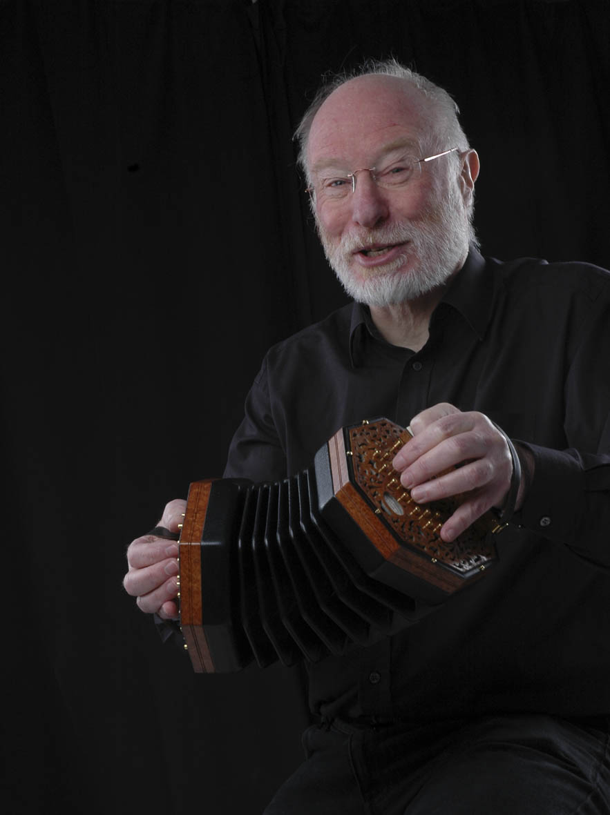 Image of Mike singing and playing concertina.